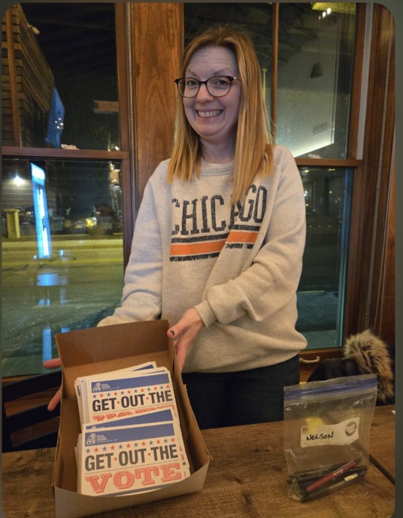 Lucy With "Get Out the Vote" Postcards for BTD's Mail-in Ballot Campaign